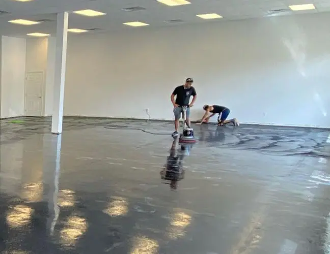 Team applying epoxy flooring