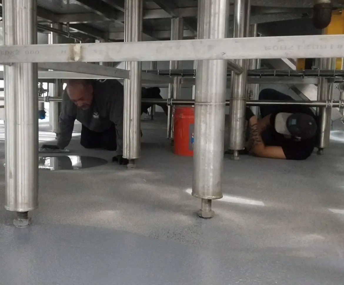 Polished seamless epoxy floor in a high-volume manufacturing plant