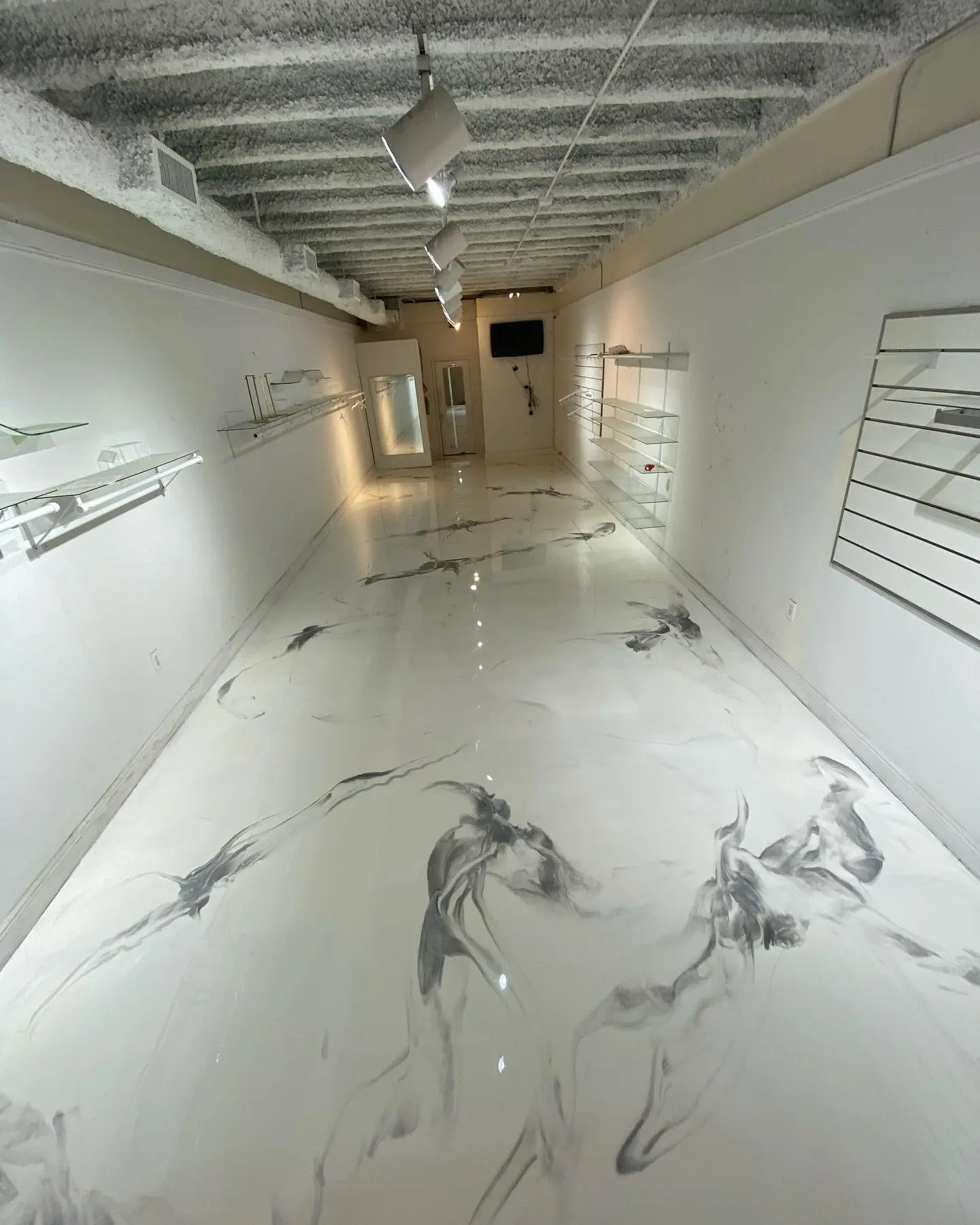 Seamless white epoxy floor finish in a Florida home interior