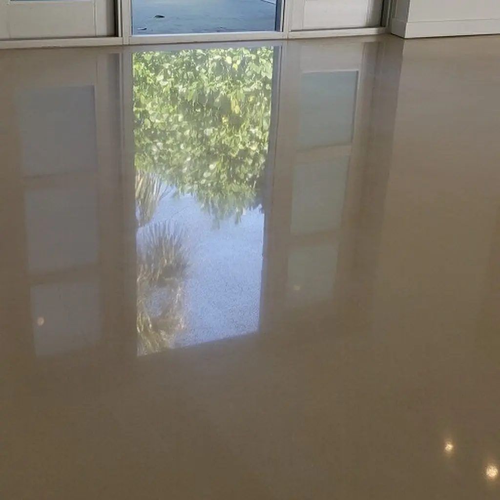 High-gloss solid epoxy flooring reflecting outdoor greenery